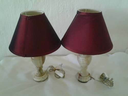 A pair of nice and heavy marble bed side table lamps in good working order wtih shades