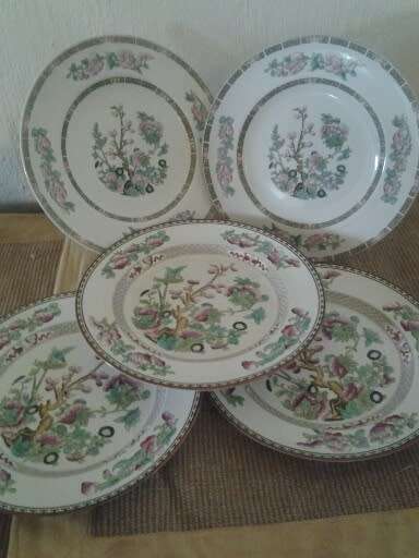 five assorted indain tree pattern dinner plates