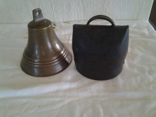 two nice large bells one brass one cow bell