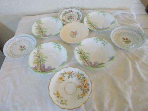 assortment selection of pretty saucers inculding royal albert