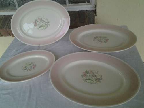 A set of four nice susie copper oval serving platters