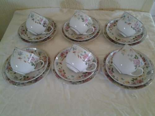 A set of six Arzberg hand painted floarl scene pretty tea cup trios