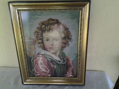 stunning framed vintage boy looking tapersty behind glass