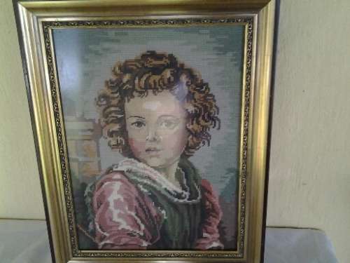 stunning framed vintage boy looking tapersty behind glass