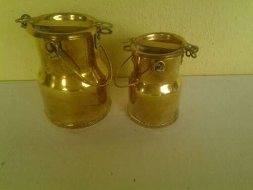 A pair of small decorative brass milk cans