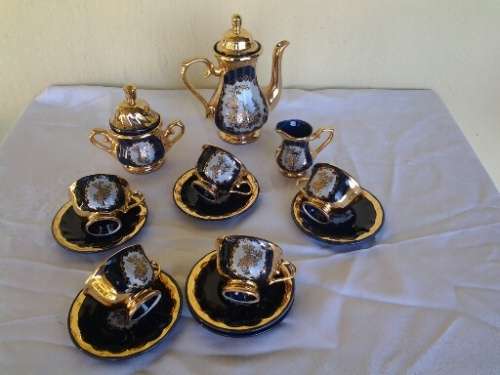 Pretty colt blue with gold floarl scene porcelain part coffee set