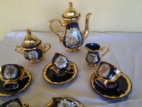 Pretty colt blue with gold floarl scene porcelain part coffee set