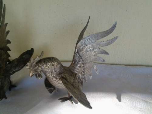 a pair of vintage sliver plated fighting roosters