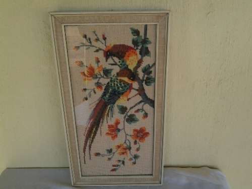 nice framed bird scene tapestry behind glass