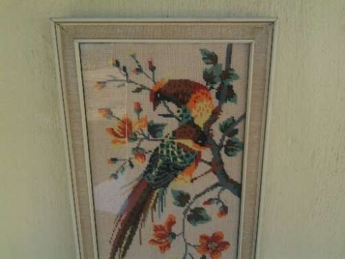 nice framed bird scene tapestry behind glass
