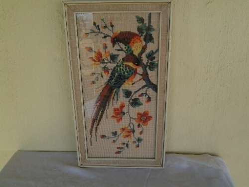 nice framed bird scene tapestry behind glass