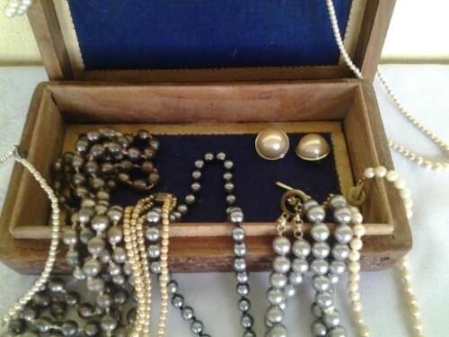 wooden jewelry box filled with some pretty costume pearls