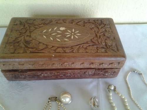 wooden jewelry box filled with some pretty costume pearls