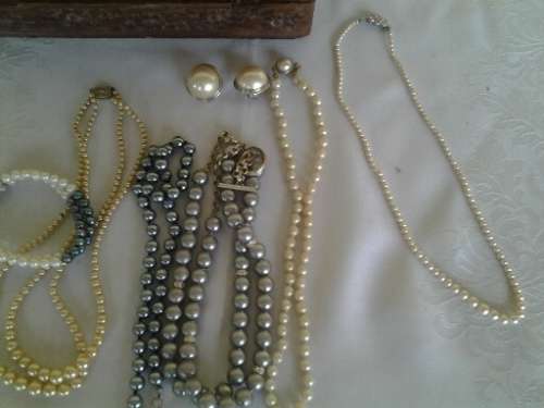 wooden jewelry box filled with some pretty costume pearls