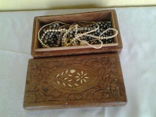 wooden jewelry box filled with some pretty costume pearls