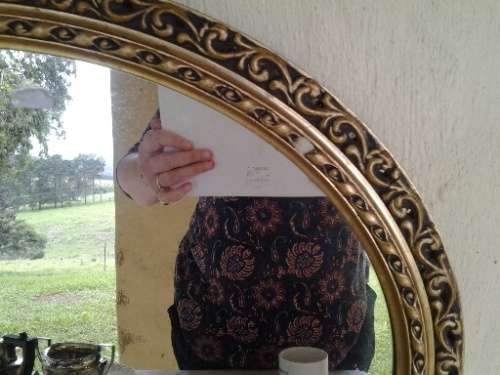 stunning round gold painted wall mirror with some slight damage noted