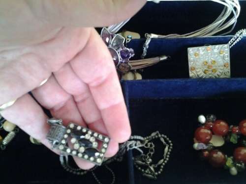 vintage jewelry box case filled with some stunning costume jewelry