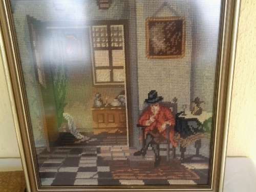 nice vintage framed tapestry behind glass