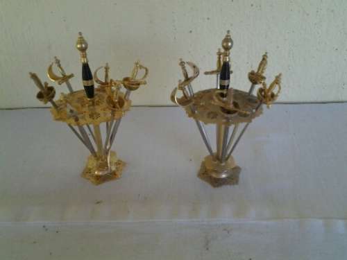 two small display metal lot of swords in a holder