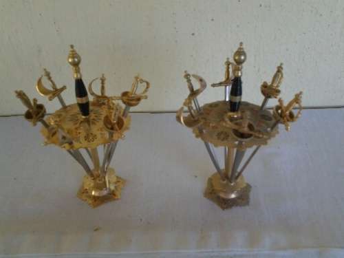 two small display metal lot of swords in a holder