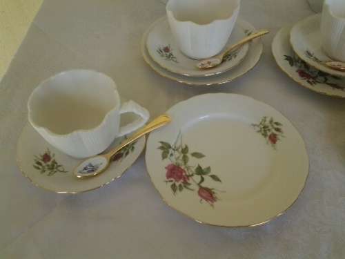 pretty mix and match vintage and modern tea set with gold spoons