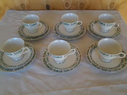 A set of six more modern porcelain tea cup trios