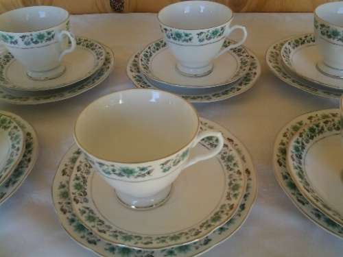A set of six more modern porcelain tea cup trios