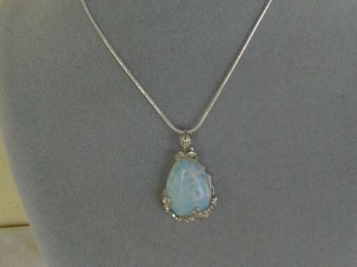 long sliver tone necklace with stunning opaline light pendant