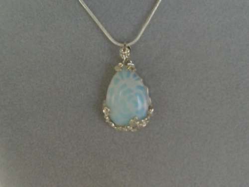 long sliver tone necklace with stunning opaline light pendant