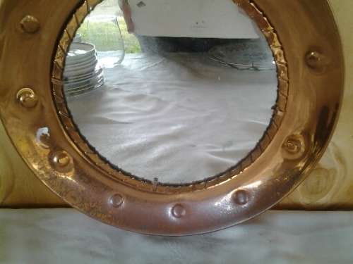 Round vintage copper wall mirror