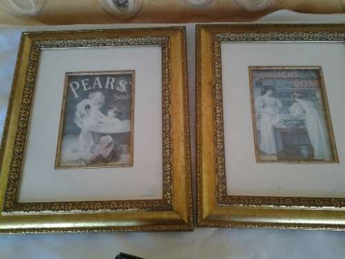 two attractive pear soap & sunlight  soap  prints behind glass