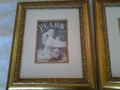 two attractive pear soap & sunlight  soap  prints behind glass