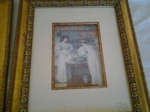 two attractive pear soap & sunlight  soap  prints behind glass