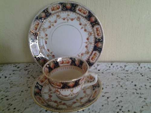 A stunning vintage porcelain Mona tea cup trio