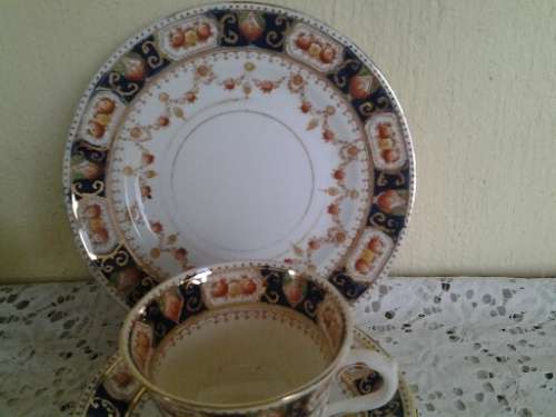 A stunning vintage porcelain Mona tea cup trio