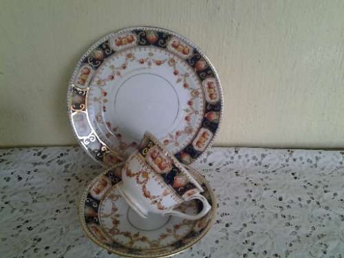 A stunning vintage porcelain Mona tea cup trio