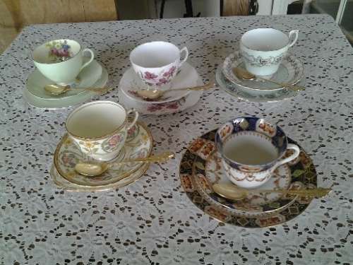 assorted lot of five vintage porcelain tea cup trios with gold tea spoons