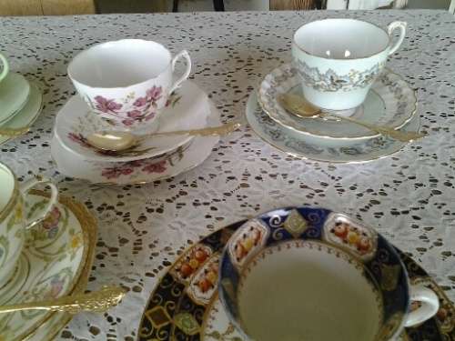 assorted lot of five vintage porcelain tea cup trios with gold tea spoons