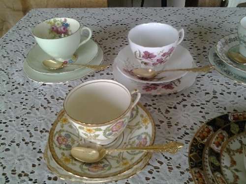 assorted lot of five vintage porcelain tea cup trios with gold tea spoons