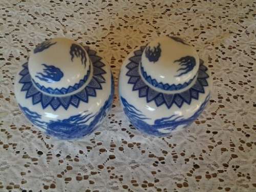 A pair of stunning blue and white oriental style dargon pattern porcelain ginger jars