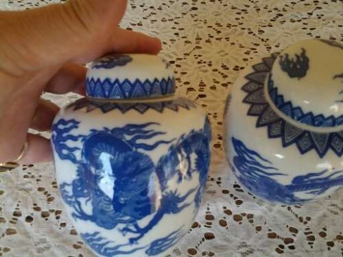 A pair of stunning blue and white oriental style dargon pattern porcelain ginger jars