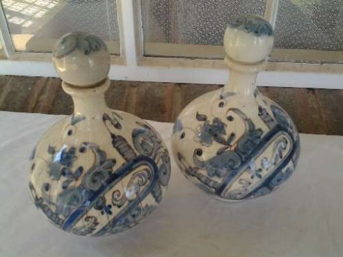 a pair of decorated blue and white porcelain decanters ? display bottles