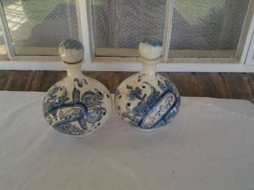 a pair of decorated blue and white porcelain decanters ? display bottles