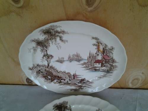 A pair of vintage Old mill scene porcelain serving platters