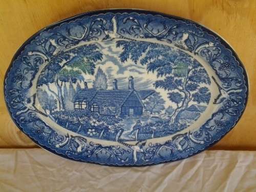 large blue and white vintage porcelain oval serving platter  with a country side scene