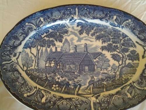 large blue and white vintage porcelain oval serving platter  with a country side scene