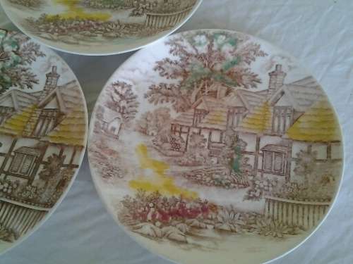 three decorative English scene porcelain dinner plates