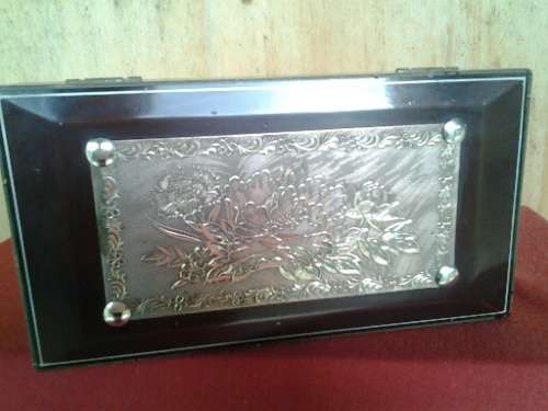 A stunning sliver plated floral pattern overlay wooden ladies jewelry musical box in working order