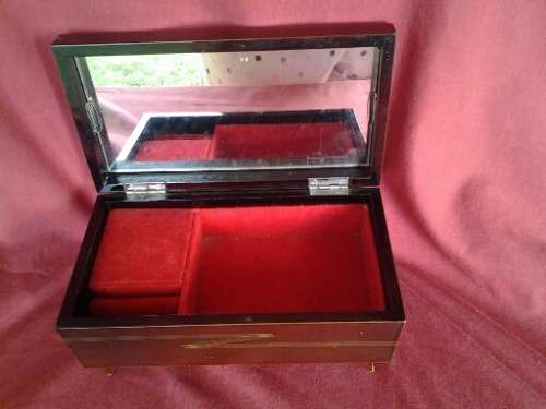 A stunning sliver plated floral pattern overlay wooden ladies jewelry musical box in working order