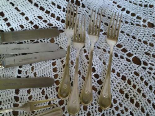 assorted lot of vintage cutlery , knifes and forks and pickle forks lot